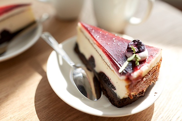 Image showing piece of chocolate cake on wooden table