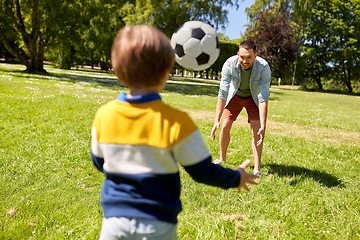 Image showing father with little son playing soccer at park