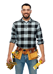 Image showing happy male worker or builder with tools and level