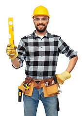 Image showing happy male worker or builder in helmet with level