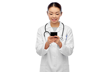 Image showing happy asian female doctor or nurse with smartphone