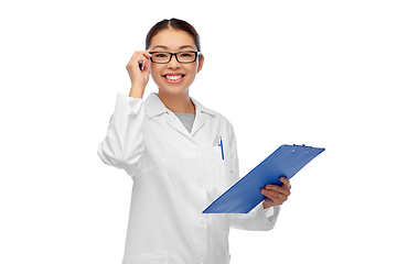 Image showing happy smiling asian female doctor with clipboard