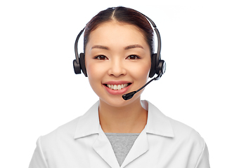 Image showing smiling asian female doctor or nurse in headset