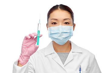 Image showing asian doctor in mask with medicine in syringe