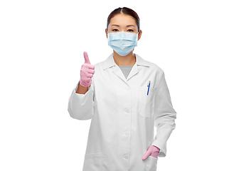 Image showing asian female doctor in mask showing thumbs up