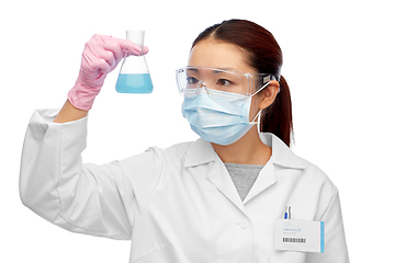 Image showing asian female scientist in mask with chemical