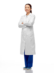 Image showing smiling asian female doctor with crossed arms