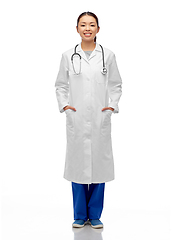 Image showing happy smiling asian female doctor in white coat