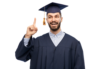 Image showing happy graduate student pointing his finger up