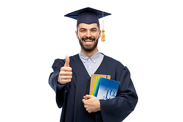 Image showing happy male graduate student showing thumbs up