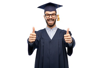 Image showing happy male graduate student showing thumbs up