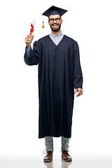 Image showing male graduate student in mortar board with diploma