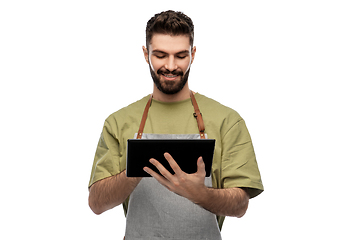 Image showing smiling waiter in apron with tablet pc computer