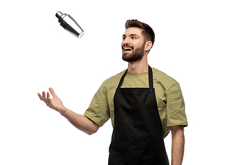 Image showing happy barman with shaker preparing