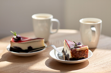 Image showing pieces of chocolate cake on wooden table