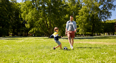 Image showing father with little son playing soccer at park