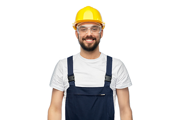 Image showing happy male worker or builder in helmet and overall