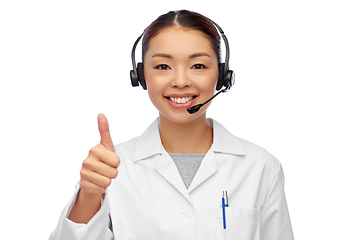 Image showing smiling asian female doctor or nurse in headset