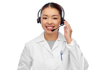 Image showing smiling asian female doctor or nurse in headset