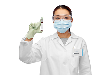 Image showing asian female doctor holding beaker with blood test