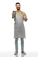 Image showing happy waiter with tumbler showing thumbs up