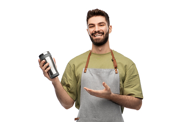 Image showing happy waiter with tumbler or takeaway thermo cup