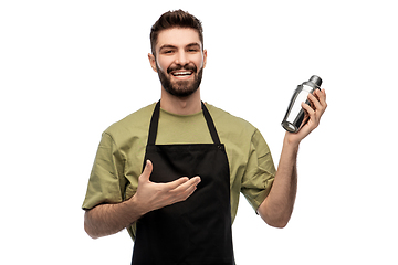 Image showing happy barman with shaker preparing