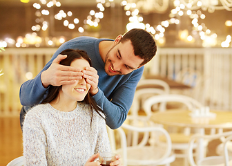 Image showing happy couple drinking tea at cafe