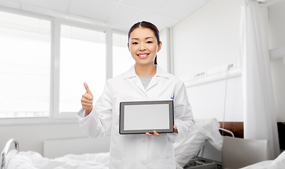 Image showing asian female doctor with tablet pc shows thumbs up