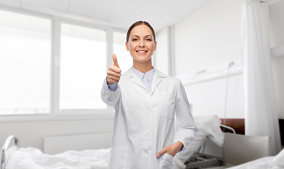 Image showing happy female doctor showing thumbs up at hospital