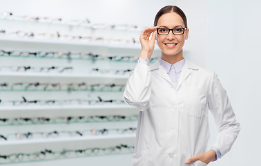 Image showing smiling female doctor in glasses at optical store