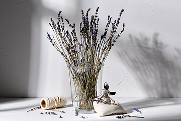 Image showing sachet bag, rope and lavender flowers in vase