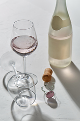 Image showing wine glasses and champagne bottle dropping shadows