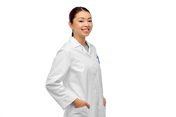 Image showing happy smiling asian female doctor in white coat