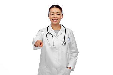 Image showing happy asian female doctor pointing to camera