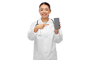 Image showing happy asian female doctor or nurse with smartphone