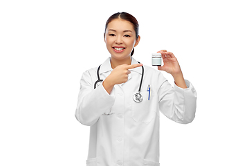 Image showing smiling asian female doctor or nurse with medicine