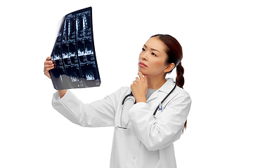 Image showing asian female doctor looking at x-ray scan