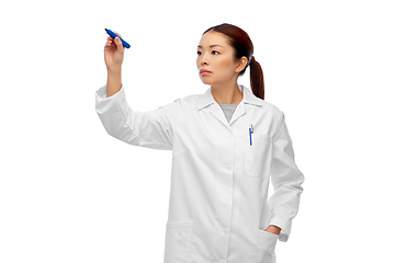 Image showing asian female doctor writing with blue marker