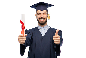 Image showing male graduate student in mortar board with diploma