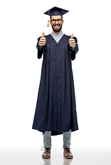 Image showing happy male graduate student showing thumbs up