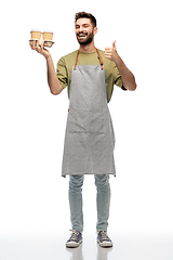 Image showing happy waiter with takeout coffee showing thumbs up