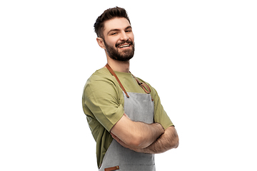 Image showing happy smiling barman in apron with crossed arms