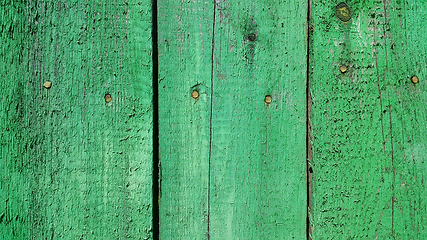 Image showing Texture of weathered wooden green painted fence