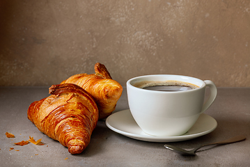 Image showing cup of coffee and croissants