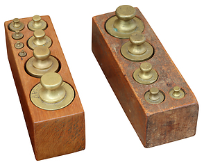 Image showing Set old vintage brass weights in wooden box isolated on white ba
