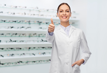 Image showing female doctor showing thumbs up at optical store