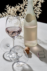 Image showing wine glasses and champagne bottle dropping shadows