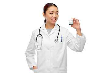 Image showing smiling asian female doctor or nurse with medicine