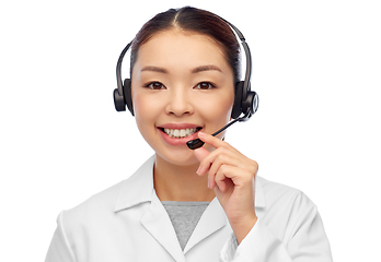 Image showing smiling asian female doctor or nurse in headset